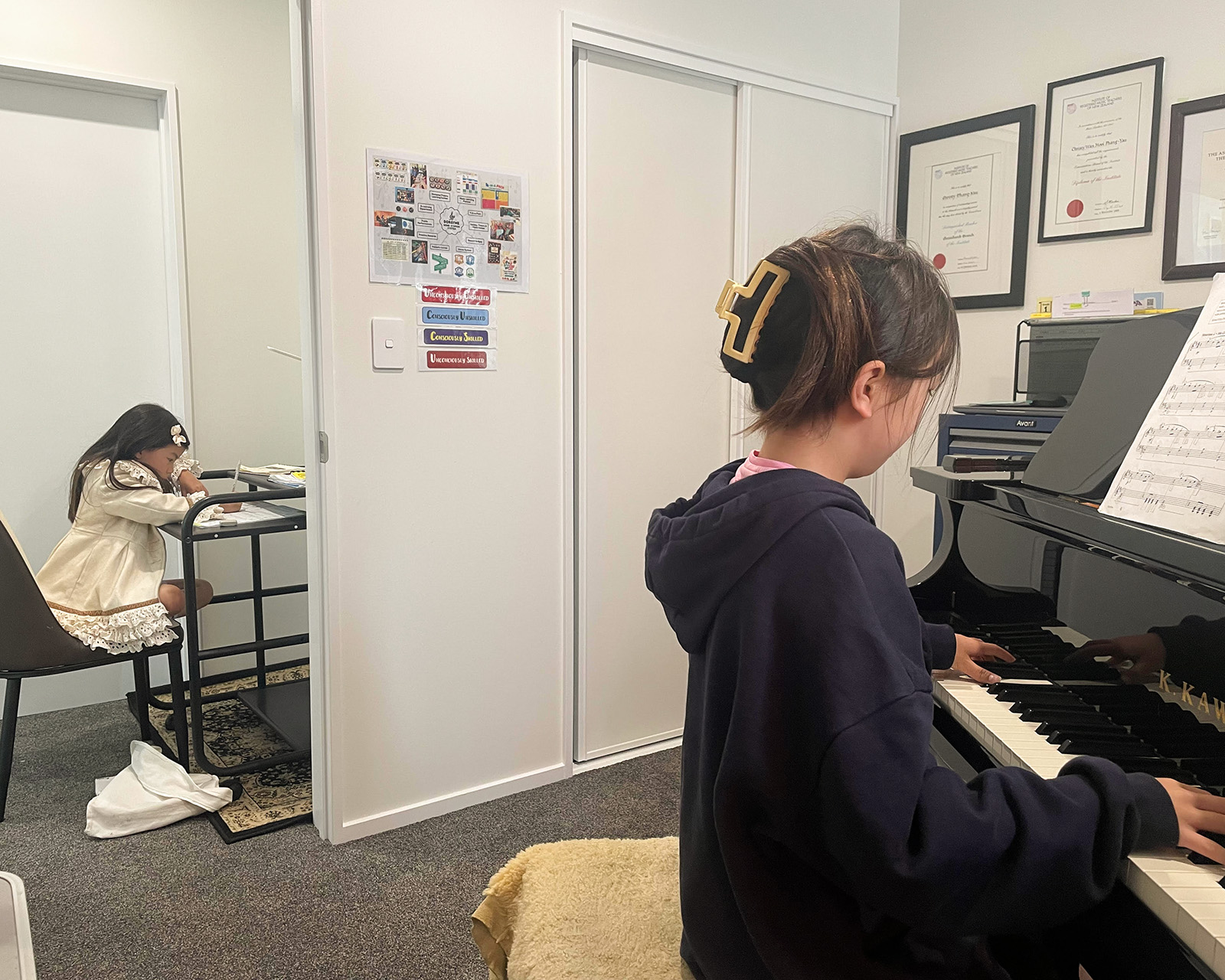 Child learning piano in a caring Christchurch music studio