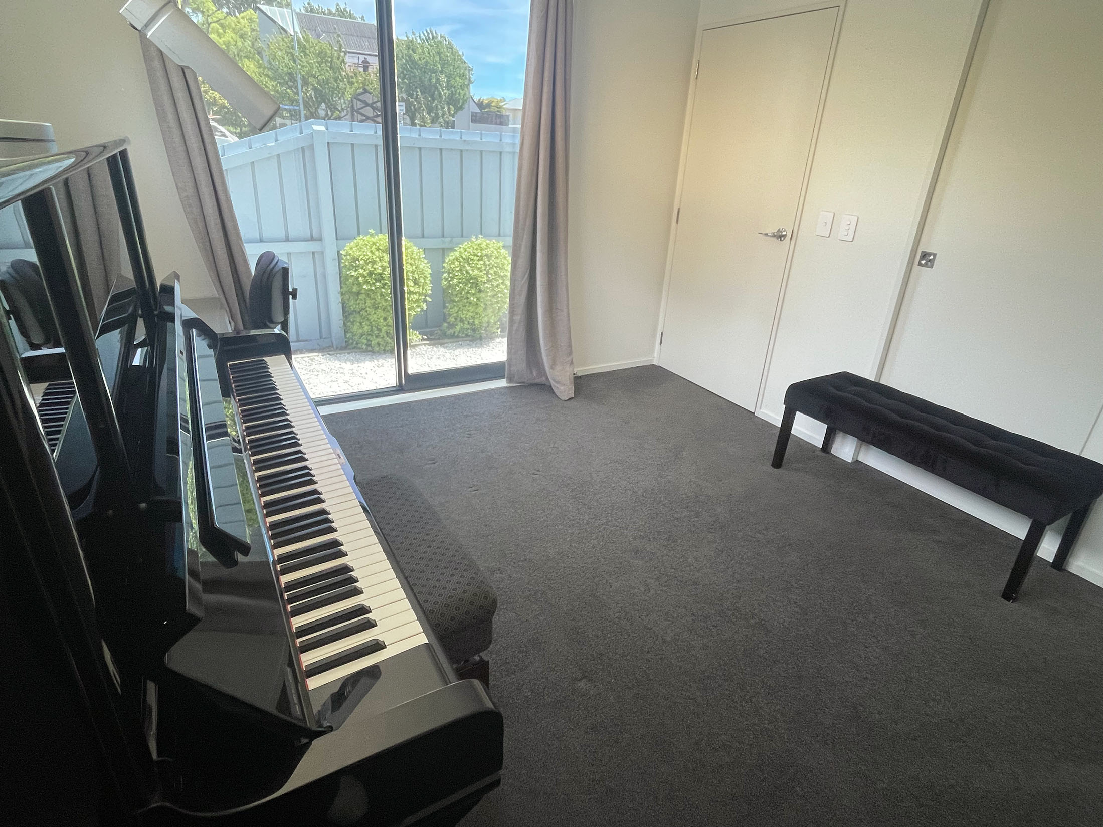 Teaching setup with piano bench and seating